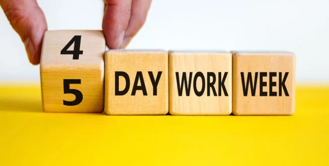 A busy office operating efficiently during a four-day workweek, showcasing the increase in productivity and employee engagement.