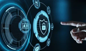 Cybersecurity expert monitoring network security on a computer screen