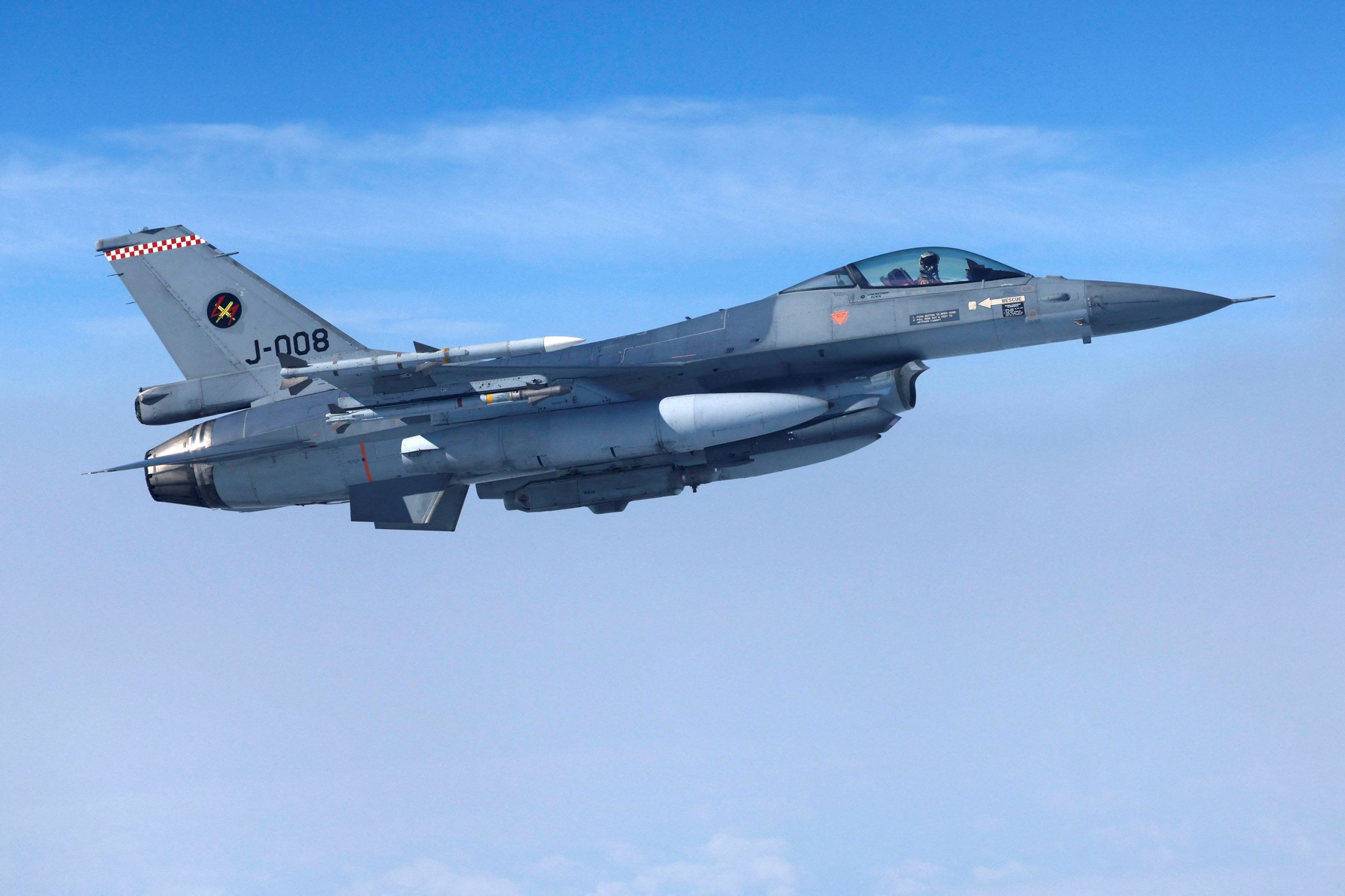Technicians prepare an F-16 jet for deployment, ensuring seamless logistics and maintenance.