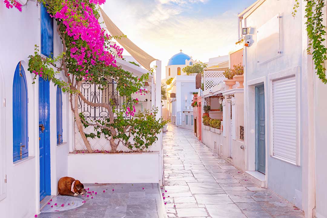 Breathtaking sunset view in Santorini with white-washed domes and the Aegean Sea.