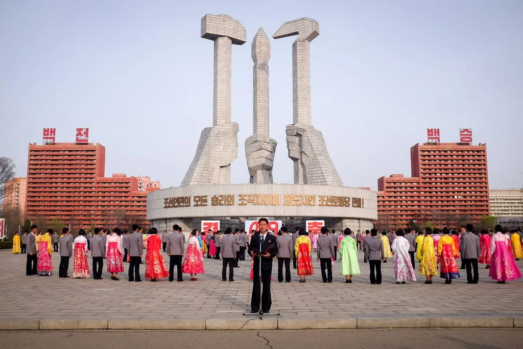 Kim Il-sung Square bustling with people during a national celebration in Pyongyang.
