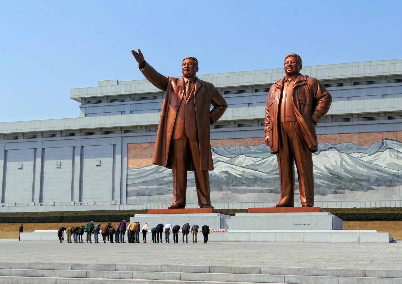Mansudae Grand Monument featuring giant bronze statues of Kim Il-sung and Kim Jong-il.