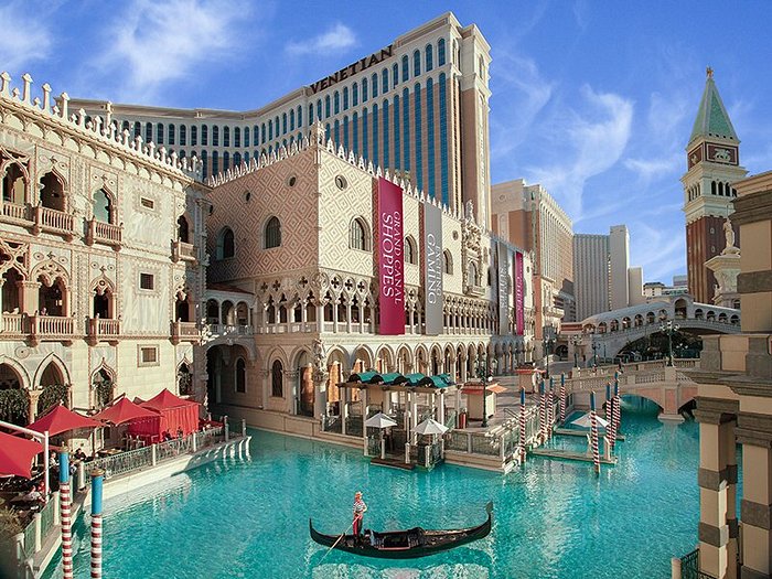 Aerial view of The Venetian Resort at night, showcasing its stunning architecture. 
